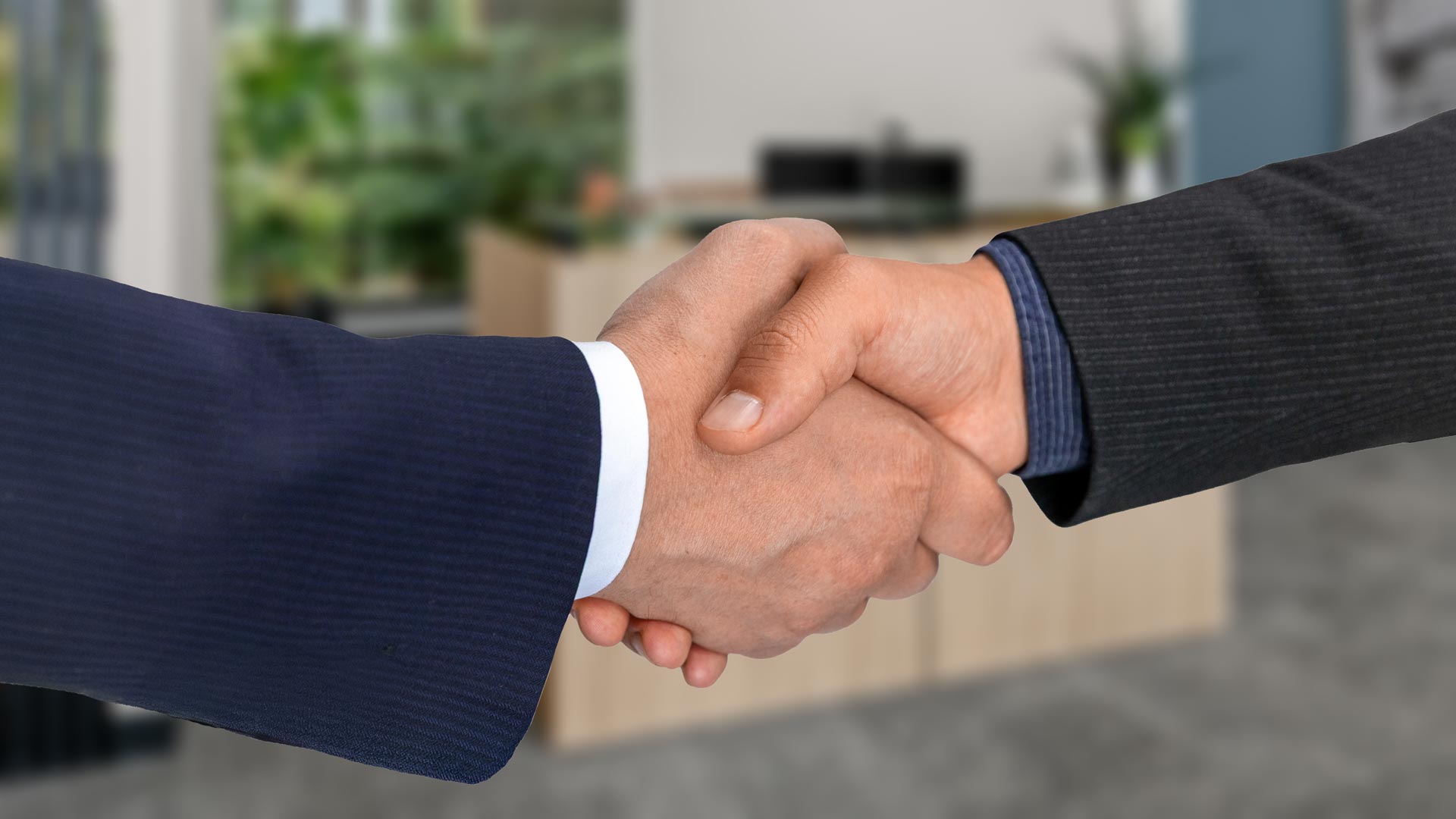 shaking hands over successful business relationship